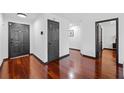 Inviting entryway with glossy hardwood floors and neutral walls, creating a clean and modern aesthetic at 3020 River Oak Mews, Decatur, GA 30034
