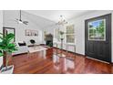 Bright living room featuring hardwood floors, a fireplace, and large windows for natural light at 3020 River Oak Mews, Decatur, GA 30034