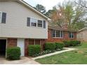 Charming split level home with brick and siding and attractive landscaping at 401 Mount Tabor Church Rd, Dallas, GA 30157