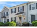 Charming townhouse featuring a well-manicured lawn and classic architectural details at 6540 Arbor Gate Sw Dr # 3, Mableton, GA 30126