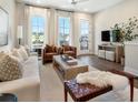 Bright living room with stylish furniture, hardwood floors, and natural light at 921 Hughley Circle Se # 66, Atlanta, GA 30316