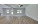 Bright living room with hardwood floors, recessed lighting, ceiling fan and multiple windows at 4554 Eastbrook Pl, Snellville, GA 30039
