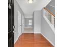 Inviting entryway with hardwood floors, staircase, and neutral paint scheme at 2555 Flat Shoals Road Rd # 1104, College Park, GA 30349