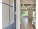 Inviting foyer with hardwood floors leading to a spacious living area with tray ceilings at 4524 Eastbrook Pl, Snellville, GA 30039