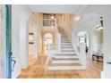 Grand foyer showcasing a staircase, hardwood floors, and elegant architectural details at 42 Greenland Trce, Atlanta, GA 30342