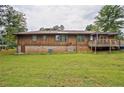 Expansive backyard with a wooden deck, offering ample space for outdoor activities and relaxation at 4296 Linda Sw Ln, Lilburn, GA 30047
