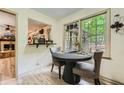 Cozy breakfast nook with natural light, hardwood floors, and table for intimate dining at 1580 Smyrna Sw Rd, Conyers, GA 30094