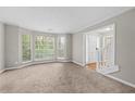 Cozy carpeted living room featuring a large bay window for natural light at 470 Piney Sw Way, Atlanta, GA 30331