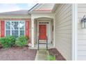 Welcoming front entrance with a red door, sidelights, and decorative trim at 502 Helene Ct, Woodstock, GA 30188