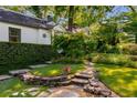 Stone pathway and lush greenery lead to this well-maintained home at 522 Trabert Nw Ave, Atlanta, GA 30309