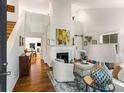 Bright living room with fireplace, hardwood floors, and high ceilings at 522 Trabert Nw Ave, Atlanta, GA 30309