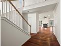 View of foyer with hardwood floors, staircase and view into the living room at 2890 Winterhaven Ct, Atlanta, GA 30360