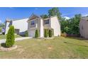 Well-maintained two-story home with tidy landscaping, offering great curb appeal in a suburban setting at 104 Auburn Crossing Way, Auburn, GA 30011