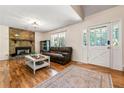 Cozy living room with a stone fireplace, hardwood floors, and a comfortable seating area at 4150 Kalb Sw Ct, Smyrna, GA 30082