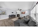 Spacious living room with fireplace, hardwood floors, and lots of natural light at 2321 Norbury Se Cv, Smyrna, GA 30080