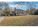 Well-maintained two-story home featuring a spacious front yard and classic colonial design at 130 Thornton Dr, Fayetteville, GA 30214
