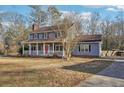 Beautiful two-story home with a covered front porch, perfect for relaxing and enjoying the view at 130 Thornton Dr, Fayetteville, GA 30214