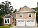 Inviting home with a two-car garage, stairs to the front door, and large bay window offers great curb appeal at 2193 Kildare Nw Way, Kennesaw, GA 30152