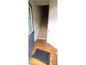 Inviting entryway with hardwood floors, staircase, and a blue front door at 3263 Mill Springs Circle Northeast Cir, Buford, GA 30519