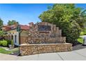 Stone entrance sign for The Villas at Camp Creek community amidst lush greenery at 178 Munira Sw Ln, Atlanta, GA 30331
