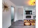 Bright living room with modern decor, an electric fireplace, and an open floor plan at 2876 Randall St, East Point, GA 30344
