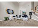 Spacious living room with soaring ceilings, modern decor, and an abundance of natural light provides comfort at 803 Baugh Springs Ln, Lawrenceville, GA 30044