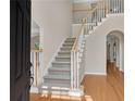 Inviting foyer featuring hardwood floors and a staircase with white railings at 1712 Bonnabel Ne Trce, Marietta, GA 30066