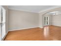 Spacious living room with hardwood floors and natural light from large windows at 1712 Bonnabel Ne Trce, Marietta, GA 30066