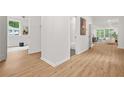 Bright hallway with hardwood floors that leads to the living room and bathroom at 2926 5Th Sw St, Atlanta, GA 30315