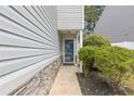 Well-maintained front entrance with stone accents, a glass front door, and neat landscaping at 3425 Sable Chase Ln, South Fulton, GA 30349