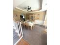 Spacious dining room with decorative molding and a table set for six at 7625 Cedar Grove Ct, Fairburn, GA 30213