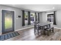 Bright dining room with modern flooring, a stylish table set, and natural light at 2903 Monterey Dr, Decatur, GA 30032