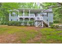 Charming front exterior with covered porch and well-maintained landscaping at 476 Cody Ln, Douglasville, GA 30134