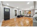 Bright living and dining area featuring hardwood floors, stylish furniture, and ample natural light at 2771 Smithsonia Way, Tucker, GA 30084
