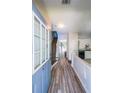 Inviting entryway with hardwood floors leading to the living area and staircase at 10900 Wittenridge Dr # C7, Alpharetta, GA 30022