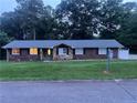 Charming single-story home with brick and stone accents, lush lawn, and inviting curb appeal at 1321 Earle Se Ct, Conyers, GA 30013
