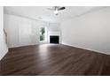 Spacious living room featuring a fireplace, updated flooring, and a bright window at 25 Timber Ridge Dr, Cartersville, GA 30121