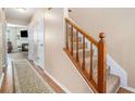 Inviting foyer with wood floors, carpeted stairs, and view into the cozy living area at 4211 Wingfoot Ct, Decatur, GA 30035