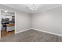 Dining room with gray walls and wood floors adjacent to kitchen at 765 Houston Mill Ne Rd # 7, Atlanta, GA 30329