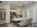 Open kitchen and dining area with granite countertops, stainless steel appliances, and room to entertain at 1207 Summit North Ne Dr # 1207, Atlanta, GA 30324