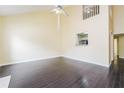 Bright living area with hardwood floors and a view to the kitchen at 5867 Trent Walk Dr, Lithonia, GA 30038