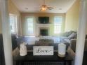 Bright living room showcasing a fireplace, neutral decor, and stylish furnishings at 35 Creek Bend Trl, Oxford, GA 30054