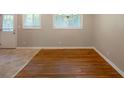 Sunlit dining area with hardwood floors, neutral walls, and a view to the backyard at 4345 Kimball Sw Rd, Atlanta, GA 30331