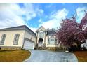 Home with a well-manicured lawn and a flowering tree adding to its curb appeal at 4770 Powers Park Ne Ct, Marietta, GA 30067