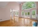 Open living room with hardwood floors, tall windows, and plenty of natural light at 4770 Powers Park Ne Ct, Marietta, GA 30067