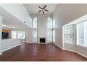 Bright and airy living room with high ceilings, fireplace, and large windows offering plenty of natural light at 6509 Charter Way, Lithonia, GA 30058