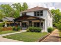 Charming two-story home featuring inviting front porch and manicured landscaping in a quiet neighborhood at 1354 Mcpherson Se Ave, Atlanta, GA 30316