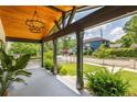 Welcoming front porch showcasing stained wood ceiling, modern lighting, and serene neighborhood views at 1354 Mcpherson Se Ave, Atlanta, GA 30316