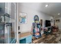 Stylish entryway featuring a stained glass front door, hardwood floors, and eclectic decor at 1915 Cooper Landing Se Dr, Smyrna, GA 30080