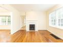 Spacious living room features hardwood floors, large windows, and a decorative fireplace at 70 Mount Paran Ne Rd, Atlanta, GA 30342